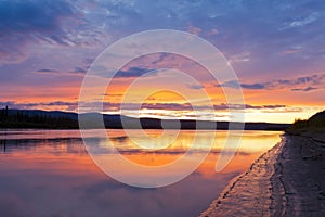 Beautiful sunset over Yukon River near Dawson City