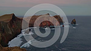 Beautiful sunset overlooking the rocky coast of Madeira Island.