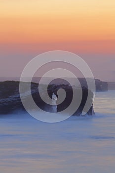 Beautiful sunset on Playa de las Catedrales during inflow photo