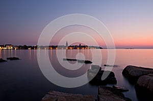 Beautiful sunset with the Porec town skyline
