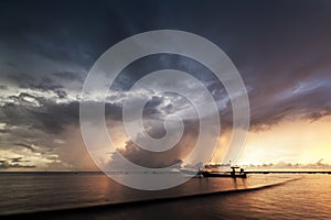 Beautiful sunset and rain storm with Opossum shrimp boats