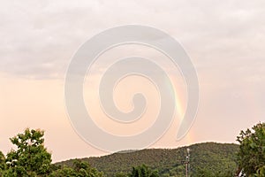 Beautiful sunset with rainbow over jungle, thailand