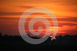 Beautiful sunset with red clouds on a calm evening.