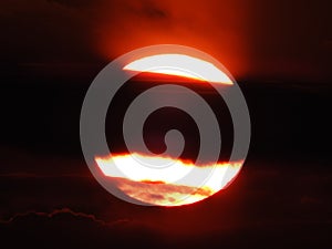 A beautiful sunset .Red sun in the cloud.