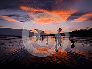 Beautiful sunset reflection on sea beach.