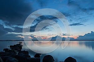 Beautiful sunset with rock in the foreground, Ijselmeer Holland