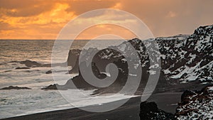 Beautiful sunset on a rocky beach in Iceland photo
