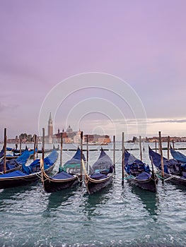 Beautiful sunset from San Marco square, Venice, Italy, overlooking the gondolas and the church of San Giorgio Maggiore