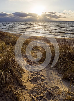 Beautiful sunset on the sandy beach and dunes of the Baltic Sea in Lithuania, Klaipeda
