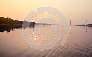 Beautiful Sunset scene On Lake water surface natural composition. Sunset over lake