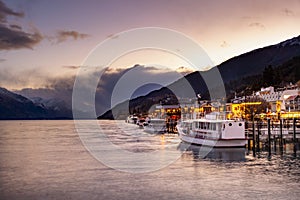 Beautiful sunset scene at pier of lake wakatipu queenstown southland new zealand