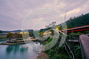 Beautiful sunset scenics of Concentric bridge with Plumeria pine parks in Sun Moon Lake