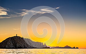 Beautiful Sunset of Seascape with Mountains silhouets. Sea off the Coast of Cabo San Lucas. Gulf of California also known as the photo