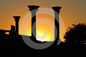 Beautiful sunset with silhouette of ancient columns at Chersonese of Taurida, Crimea.