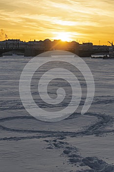 Beautiful sunset and silhouette of a heart on a snowy river Saint Petersburg, Russia