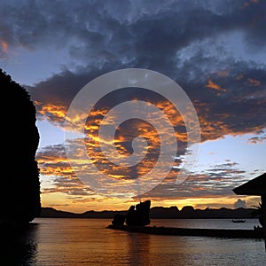 Beautiful sunset with silhouettes of philippine boats in El Nido, Palawan island, Philippines