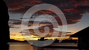 Beautiful sunset with silhouettes of philippine boats in El Nido, Palawan island, Philippines