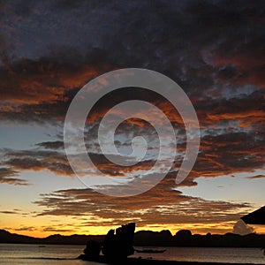 Beautiful sunset with silhouettes of philippine boats in El Nido, Palawan island, Philippines