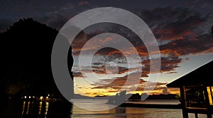 Beautiful sunset with silhouettes of philippine boats in El Nido, Palawan island, Philippines