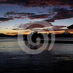 Beautiful sunset with silhouettes of philippine boats in El Nido, Palawan island, Philippines