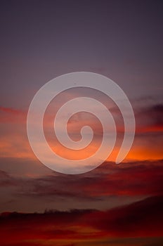 Beautiful sunset sky with amazing colorful clouds against deep