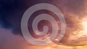 Beautiful sunset sky with clouds. Sky blue and orange light of the sun through the clouds in sky. Background of dark