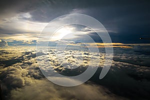 Beautiful sunset sky clouds seeing through the airplane windows.