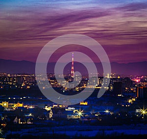 Beautiful sunset sky over the evening city