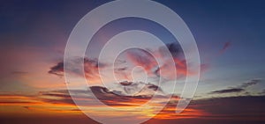 Beautiful sunset sky with some clouds