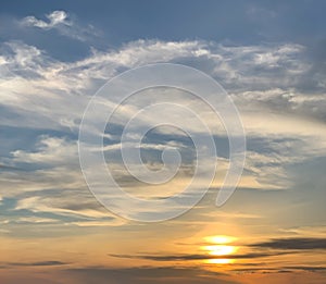 Beautiful sunset sky with some clouds