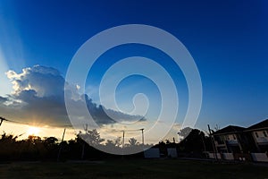 Beautiful sunset sky with sunlight through cloudy