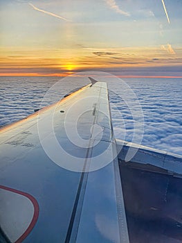 Beautiful sunset sky view through airliner porthole