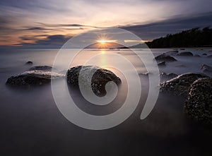 Beautiful sunset at the stone beach