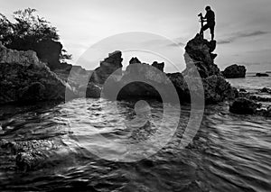 Beautiful sunset at the stone beach in black and white