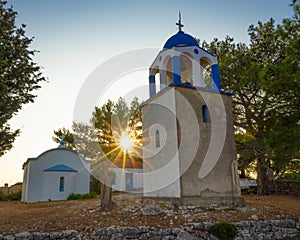 Beautiful sunset sun over the Monastery of Panagia Eleousa, Ithaka Island, Greece
