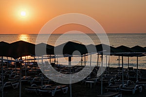 Beautiful sunset sunrise beach with pink sky and pier. Travel, relax and meditation concept