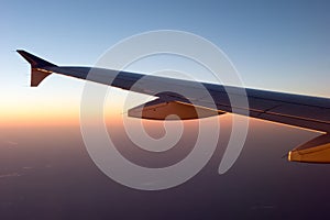 Beautiful sunset view from an airplane over land
