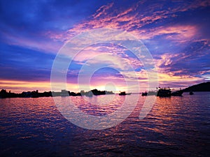 Beautiful sunset view along the beach with blue sky.