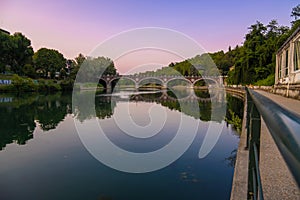 Beautiful sunset view of the arch bridge over the river Po in the city of Turin, Italy