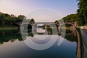 Beautiful sunset view of the arch bridge over the river Po in the city of Turin, Italy