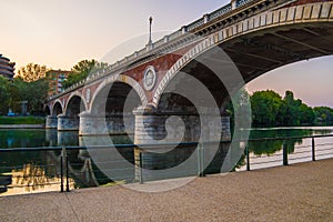 Beautiful sunset view of the arch bridge over the river Po in the city of Turin, Italy