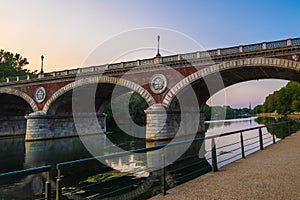 Beautiful sunset view of the arch bridge over the river Po in the city of Turin, Italy
