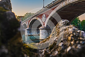 Beautiful sunset view of the arch bridge over the river Po in the city of Turin, Italy