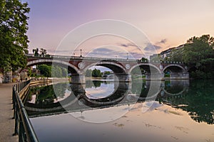 Beautiful sunset view of the arch bridge over the river Po in the city of Turin, Italy