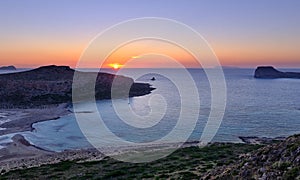 Beautiful sunset view of Cape Tigani and Gramvousa islet from Balos beach, Crete, Greece.