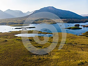 Beautiful sunset view of Connemara. Scenic Irish countryside landscape with magnificent mountains on the horizon, County Galway, I