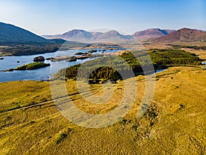 Beautiful sunset view of Connemara region in Ireland. Scenic Irish countryside landscape with magnificent mountains on the horizon