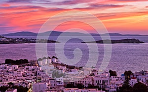 Beautiful sunset view, famous traditional white windmills on hilltop, Mykonos, Greece. Whitewashed house, summer, iconic