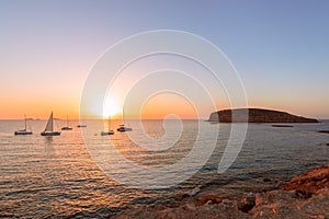 Beautiful sunset view on the island of Ibiza. View from the beach Cala Escondida Cala Comte. Balearic Islands. Spain
