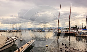 Beautiful Sunset view at Lausanne Marina with yachts on Lake Geneva, Lausanne Ouchy fishing village, Switzerland, Europe